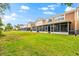 Expansive backyard featuring lush green grass and screened in patios at 8209 72Nd E St, University Park, FL 34201
