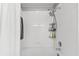 Clean white bathroom featuring a shower with updated fixtures at 8209 72Nd E St, University Park, FL 34201