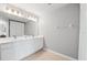 Bright bathroom with a double sink vanity and tile flooring at 8209 72Nd E St, University Park, FL 34201