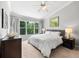 Comfortable bedroom with natural light, ceiling fan, and neutral decor at 8209 72Nd E St, University Park, FL 34201