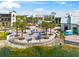 Charming community gathering spot with seating, lush landscaping, and serene lake views at 8209 72Nd E St, University Park, FL 34201