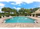 Inviting community pool with plenty of lounge chairs and a shaded pavilion at 8209 72Nd E St, University Park, FL 34201