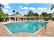Inviting community pool with plenty of lounge chairs and a shaded pavilion at 8209 72Nd E St, University Park, FL 34201