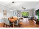 Bright dining area with hardwood floors and a seamless view to the exterior patio at 8209 72Nd E St, University Park, FL 34201