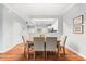 Charming dining room featuring wood flooring and seating for four, adjacent to the kitchen at 8209 72Nd E St, University Park, FL 34201