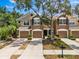 Charming townhome featuring a two-car garage, manicured landscaping, and a welcoming entrance at 8209 72Nd E St, University Park, FL 34201
