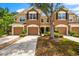 Beautiful townhome with a two-car garage, well-maintained landscaping, and a cozy front entrance at 8209 72Nd E St, University Park, FL 34201
