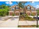 Inviting townhome with a two-car garage, nicely landscaped front yard, and pleasant street view at 8209 72Nd E St, University Park, FL 34201