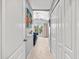 Hallway leading to a bedroom featuring a comfortable lounge area and natural light at 8209 72Nd E St, University Park, FL 34201