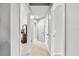 Well-lit hallway with white doors and neutral carpet, creating a clean and inviting space at 8209 72Nd E St, University Park, FL 34201