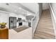 Contemporary kitchen with white cabinetry, stainless steel appliances, and a cozy rug on the tiled floor at 8209 72Nd E St, University Park, FL 34201