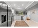 Modern kitchen featuring stainless steel appliances and elegant white cabinetry at 8209 72Nd E St, University Park, FL 34201