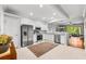 Modern kitchen with stainless steel appliances and white cabinetry offers a seamless transition to the living area at 8209 72Nd E St, University Park, FL 34201
