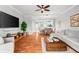Well-lit living area offers a harmonious blend of the living room, dining area, and kitchen at 8209 72Nd E St, University Park, FL 34201