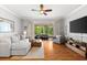 Comfortable living room with hardwood floors and a view of the outside through sliding glass doors at 8209 72Nd E St, University Park, FL 34201