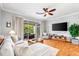 Inviting living room with sliding glass doors, offering serene backyard views and ample natural light at 8209 72Nd E St, University Park, FL 34201
