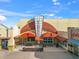 Exterior view of a movie theater in a town center with inviting signage and outdoor seating at 8209 72Nd E St, University Park, FL 34201