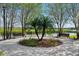 Serene park view with benches, landscaping, and glimpses of the lake, perfect for relaxation at 8209 72Nd E St, University Park, FL 34201