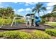 Community playground for with slide and swings surrounded by mulch at 8209 72Nd E St, University Park, FL 34201