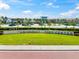 Landscaped entrance to a mall and shopping center with lush green lawn and clear blue sky at 8209 72Nd E St, University Park, FL 34201
