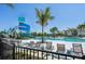 Resort-style community pool with a water slide and plenty of lounge chairs at 9970 Cross River Trl, Parrish, FL 34219