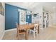 Stylish dining room featuring modern decor and a bright accent wall at 9970 Cross River Trl, Parrish, FL 34219