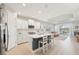 Modern kitchen featuring stainless steel appliances, a central island, and an open layout at 9970 Cross River Trl, Parrish, FL 34219