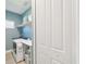 Functional laundry area featuring modern washer, dryer, counter space, and overhead storage solutions at 9970 Cross River Trl, Parrish, FL 34219