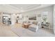 Spacious living room featuring modern decor and an open layout connecting to the kitchen at 9970 Cross River Trl, Parrish, FL 34219