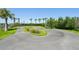 An outdoor pump track featuring a paved track surface surrounded by landscaping at 9970 Cross River Trl, Parrish, FL 34219