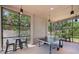 A recreation room with floor-to-ceiling windows, a ping pong table, and chairs at 9970 Cross River Trl, Parrish, FL 34219