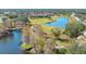 Scenic aerial view featuring a golf course and a beautiful lake at 6748 Fairview Ter # 4-202, Bradenton, FL 34203