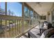 Spacious screened lanai with water views, ceiling fan, and plenty of room for entertaining at 6748 Fairview Ter # 4-202, Bradenton, FL 34203