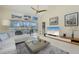 Cozy living room with a large window, slider to screened in lanai, and modern decor at 6748 Fairview Ter # 4-202, Bradenton, FL 34203