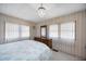 Comfortable bedroom with chandelier, large dresser and good natural lighting at 1005 45Th E Ave, Ellenton, FL 34222