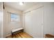 Bedroom area featuring closet, bench and window providing natural light at 1005 45Th E Ave, Ellenton, FL 34222