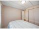 Bedroom with bed, patterned wallpaper and closet with sliding doors at 1005 45Th E Ave, Ellenton, FL 34222