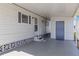 Covered carport area providing convenient access to the home with a door at 1005 45Th E Ave, Ellenton, FL 34222