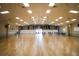 Spacious community hall with hardwood floors, flags, and recessed lighting at 1005 45Th E Ave, Ellenton, FL 34222