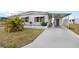 Charming single-story home with a covered carport, landscaped yard, and a welcoming facade at 1005 45Th E Ave, Ellenton, FL 34222