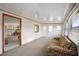 Bright sun room connects to kitchen and dining area, filled with natural light at 1005 45Th E Ave, Ellenton, FL 34222