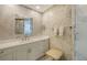 The bathroom featuring white marble tile, vanity and standing shower at 1241 Gulf Of Mexico Dr # 803, Longboat Key, FL 34228