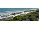 Stunning beach with white sand, clear blue water, and lush vegetation at 1241 Gulf Of Mexico Dr # 803, Longboat Key, FL 34228