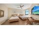 Bedroom featuring a desk and water views at 1241 Gulf Of Mexico Dr # 803, Longboat Key, FL 34228