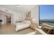 This bedroom has beautiful bright lighting and an amazing waterfront view at 1241 Gulf Of Mexico Dr # 803, Longboat Key, FL 34228