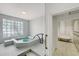 Community hot tub room with tiled floors, and privacy glass block window at 1241 Gulf Of Mexico Dr # 803, Longboat Key, FL 34228