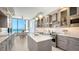 Gourmet kitchen with stainless steel appliances, stone countertops, and stunning ocean views from the breakfast nook at 1241 Gulf Of Mexico Dr # 803, Longboat Key, FL 34228