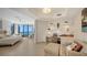 This primary bedroom has a built in desk with shelving and ocean views at 1241 Gulf Of Mexico Dr # 803, Longboat Key, FL 34228