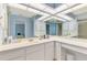 Bright bathroom with a spacious vanity, ample lighting, and wall-to-wall mirror at 1271 Nantucket Rd, Venice, FL 34293