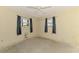 Bedroom with two windows and a ceiling fan at 1271 Nantucket Rd, Venice, FL 34293